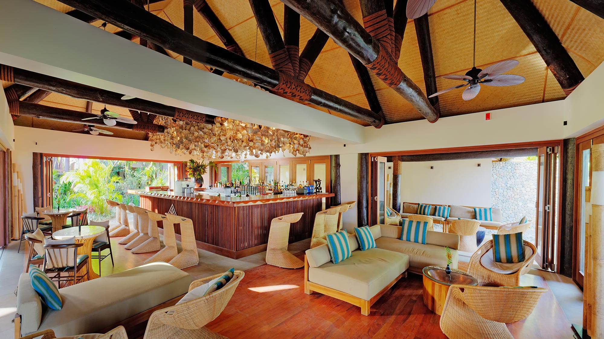 Lounge with colorful bar and ceiling fans